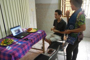 Steve and Meden using a computer station