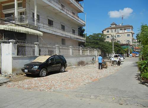 Paving the area beside DDP with rubble.