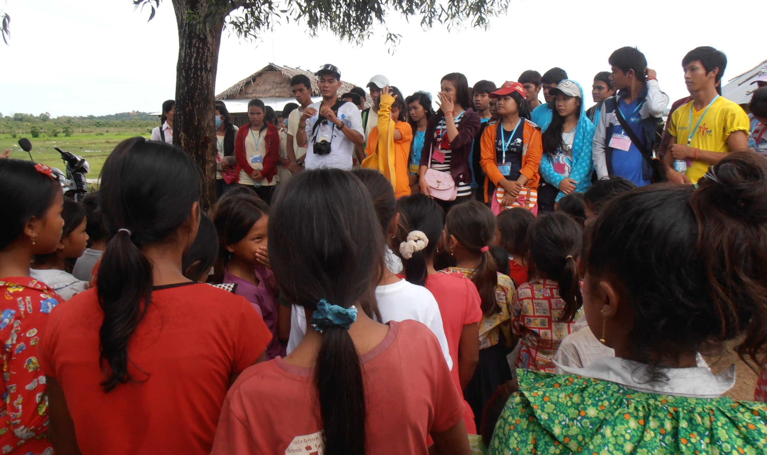 The children of the village welcoming our youth