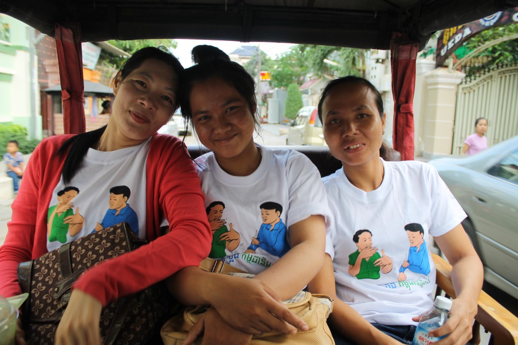 DDP representatives in the tuktuk to the Ministry with the t-shirts gifted by the ministry