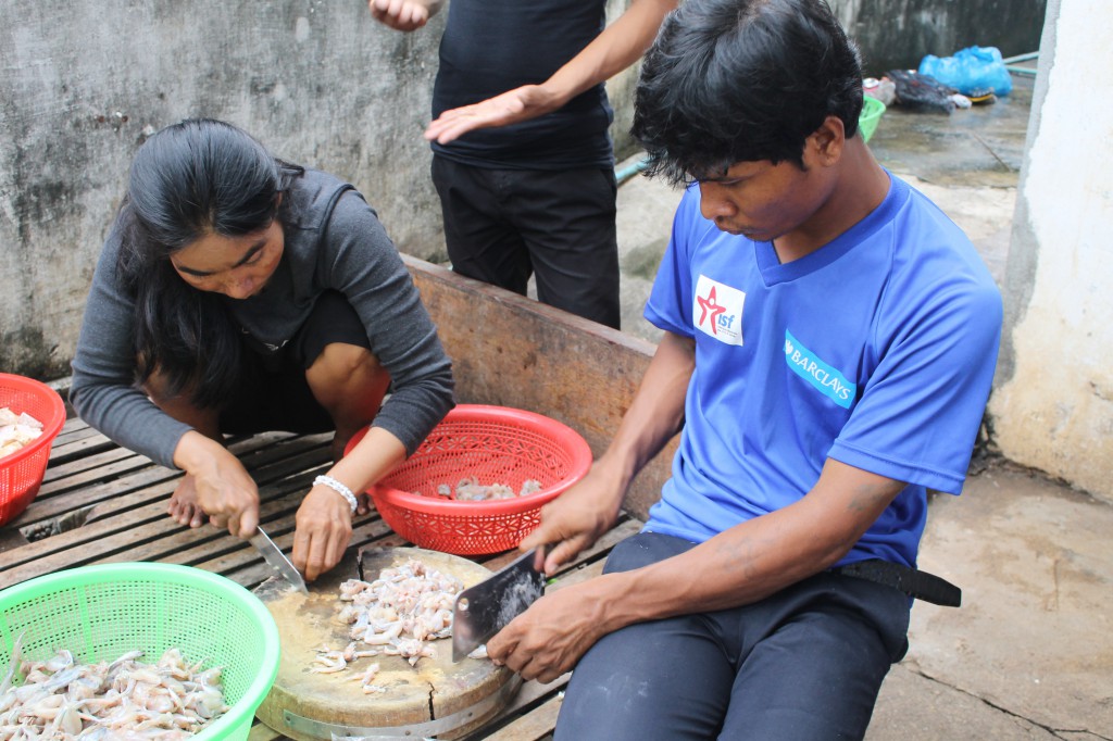 Students in Kampong Cham preparing dinner.  They assist both in meal planning and preparations.