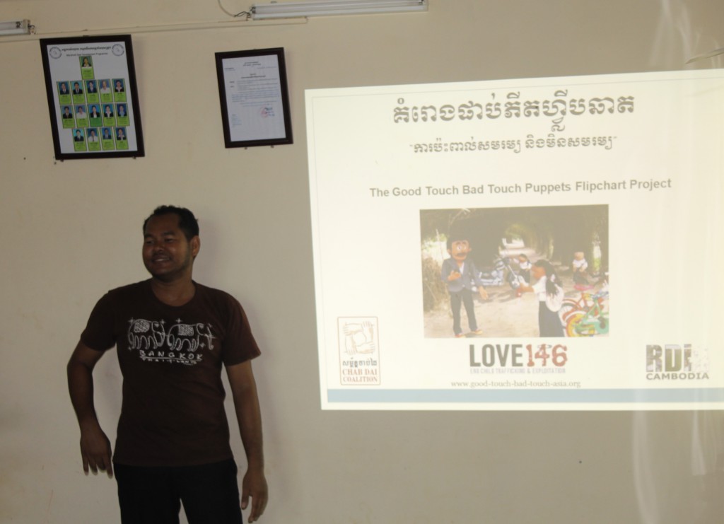Chamroeun, DCC field worker in Phnom Penh giving a presentation on Good Touch, Bad Touch that was prepared by Love 146.