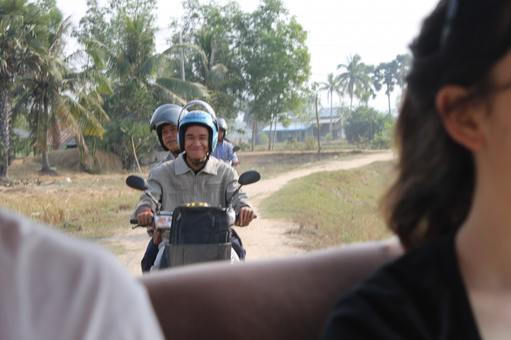 Field Worker teams following our tuktuk out to meet some deaf youth in the village